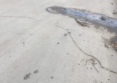 Water Bubbling Up From a Manhole Cover